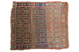 Antique West Persian square rug. Floral medallions in madder red, navy, saffron, and brown. Varied pile.