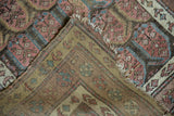Antique Northwest Persian runner's hand-knotted foundation, worn pile, and tattered fringe.