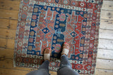 Late 19th century Serapi rug with navy blue and madder root red double rectangular medallions.
