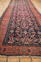 Antique Malayer rug runner showing the detailed navy Herati motif and early inspired blush border.