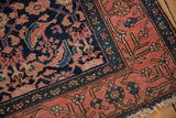 Traditional Persian Malayer runner's Herati motif and early inspired border in navy and blush.