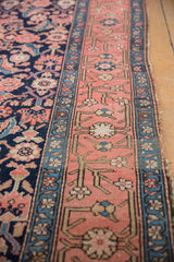 Antique Malayer runner detail: dusty blush main border, ivory and blue florals, and navy Herati field.