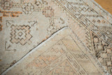Vintage Distressed Oushak rug's hand-knotted foundation, secured edge, and faded ivory pile.