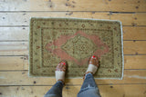 Antique Distressed Jalili Tabriz rug with dusty pink medallion, boteh paisley motifs, and low pile.