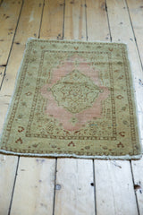 Antique distressed Jalili Tabriz corner shows dusty pink boteh paisley and low pile wear.