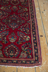 Intact original side cord selvage and intricate floral border of the vintage Sarouk.