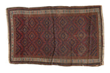 Antique Belouch rug, circa 1910s, wine red serrated diamonds, navy blue accents, patterned borders.