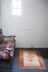 Antique Malayer rug with an intricate diamond medallion, palmettes, guls, and meandering red borders.