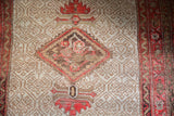 Antique Malayer rug: diamond medallion, palmette finials, ivory lattice with even wear.