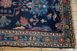 Vintage Baktiari rug corner detail, indigo field, blush, beige floral borders, fringe.