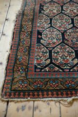 Tattered edge with low pile and reciprocating pawn borders of an antique Northwest Persian rug.