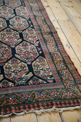 Antique Northwest Persian rug's madder red, teal reciprocating pawn border and tattered edge.