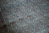 Detailed pile of antique Doroksh rug's allover boteh paisley, with muted navy, red, ivory tones.