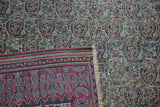 Antique Doroksh rug corner, showing woven foundation, red border, and mostly even wear.