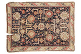 Antique Caucasian rug, allover geometric design with medallions and starbursts, in time-softened navy, madder red, and ivory tones.