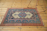 Antique Persian Serab collector rug showing rich color saturation and its full geometric medallion design.