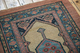 The rare, intact camel hair border and layered floral motifs on an antique Persian Serab rug.