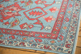 New Oushak rug corner with powder blue field, madder red boteh, and ivory vine borders.