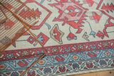 Oushak rug borders with madder root red boteh, powder blue vine, and geometric patterns.