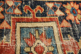Antique Karaja runner detail: geometric pattern in navy, red, and beige, with wear to knot heads and foundation.
