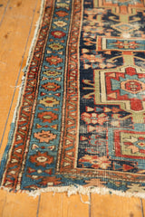 Antique Karaja runner border with primitive geometric patterns and visible historic wear.