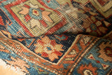Close-up of antique Karaja runner's hand-knotted pile with primitive geometric patterns.