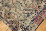 Geometric reciprocating pawn border and tattered fringe of an antique Shirvan rug.