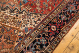 Hand-knotted Vintage Heriz carpet's navy border with brick red, sky blue, ivory patterns.
