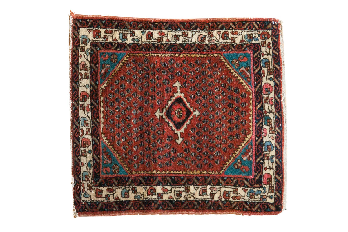 Vintage Engelas square rug with a stepped central medallion, a ruby red field of botehs, and blue corner accents.