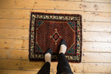 Vintage Engelas Persian rug mat shown on the floor to demonstrate its scale.