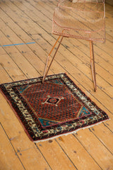 Vintage Engelas square rug showing its scale and traditional boteh pattern on a ruby-rust field.