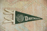 Vintage Dartmouth felt pennant, showing cream ties and dark green edge detail.