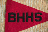 Black BHHS felt lettering on vintage red pennant, with natural wear.