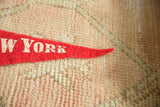 Vintage red felt New York City pennant tip, white 'W YORK' lettering, slight loss.