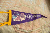Purple felt pennant with yellow binding, hanging string, and 