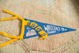 Blue felt Whiteface Mt. pennant showing yellow '1962' date and mountain graphic.