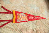 Vintage Rocky Point Park felt pennant close-up with red ties and yellow felt trim.