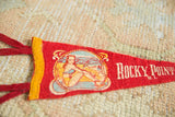 Pointed tip of the vintage Rocky Point R.I. felt pennant with white lettering.