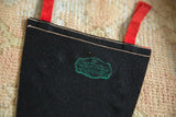 Maker's mark of The Felt Crafters stamped in green ink on the pennant's reverse.