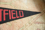 Close-up of the creased black felt and red lettering on the vintage pennant's tip.