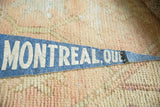 Detail of the textured blue felt and aged lettering on a vintage Montreal pennant.
