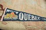 Colorful Chateau Frontenac illustration with crackled patina on the vintage felt souvenir pennant.