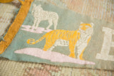 Cracked orange tiger graphic and faded lettering on the green-gray vintage Bronx Zoo pennant.