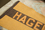 Hagerstown felt pennant's layered gold and brown lettering with detailed zig-zag stitching.