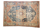 Antique Farahan Sarouk carpet, roundel medallion with floral vinery in navy, terra cotta, and ivory tones.