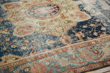 Antique Farahan Sarouk wide border showing powder blue, terra cotta vine, and softened pile.