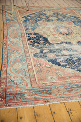 Fringed end of antique Farahan Sarouk, powder blue and terra cotta border detail with wear to knot heads.