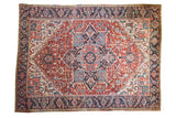 Vintage Persian Heriz carpet, large medallion, geometric motifs, cherry red, navy, ivory.