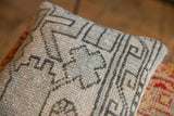 Textural geometric pattern on a vintage Turkish Oushak rug fragment pillow in gray, mint, faded pink.