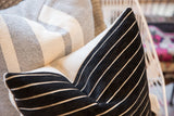 Soft black chenille velvet pillow texture with crisp white stripes.